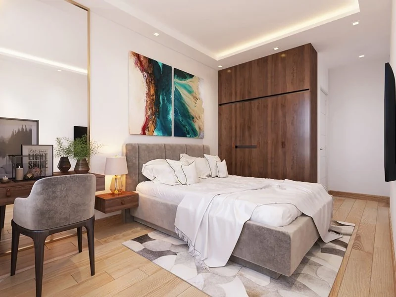 Phòng ngủ căn hộ mẫu Citrine Apartment với tủ áo gỗ